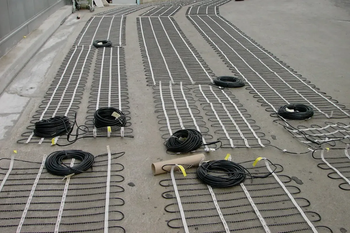Heating mats rolled out across a ramp before the pour
